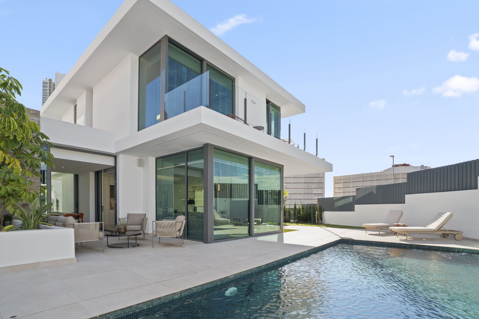 Modern exterior of a 4-bedroom villa with a pool and garden in Benidorm - The Estates