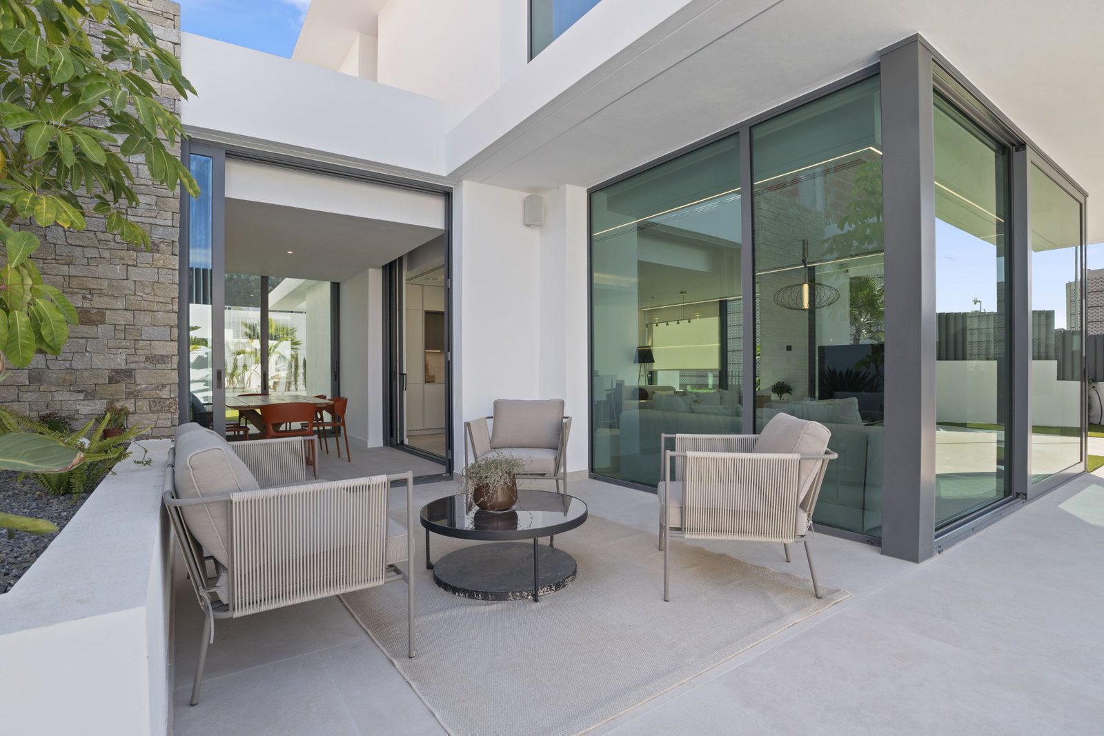 Modern outdoor living space of a 4-bedroom villa in Benidorm - The Estates