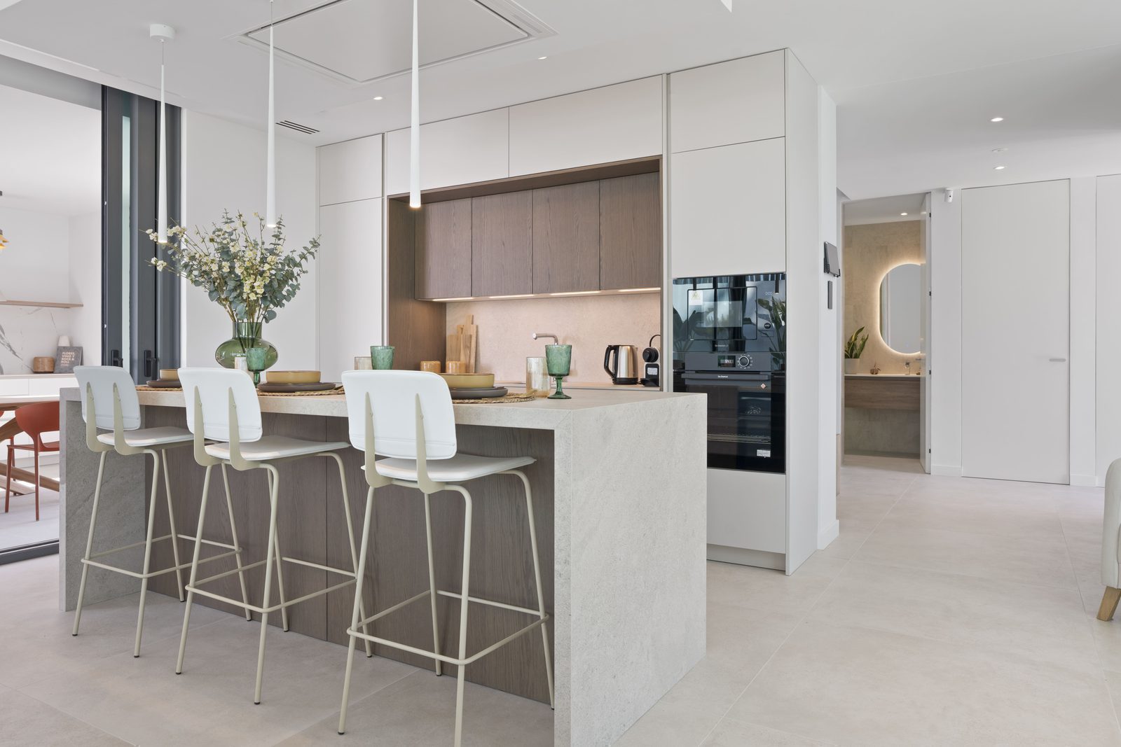 Modern kitchen with island seating in a 4-bedroom villa in Benidorm - The Estates
