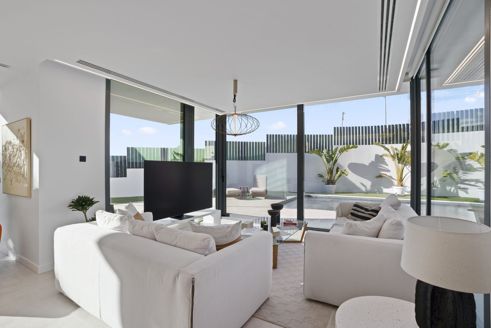 Stylish living room with garden views of a 4-bedroom villa in Benidorm - The Estates