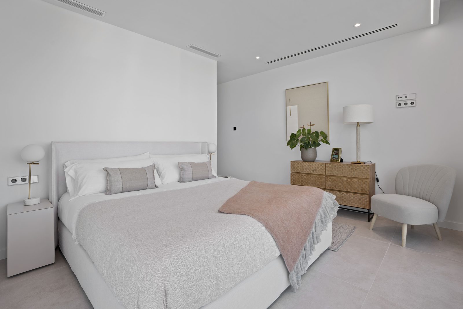 A stylish bedroom in a 4-bedroom villa in Benidorm with sea and city views - The Estates