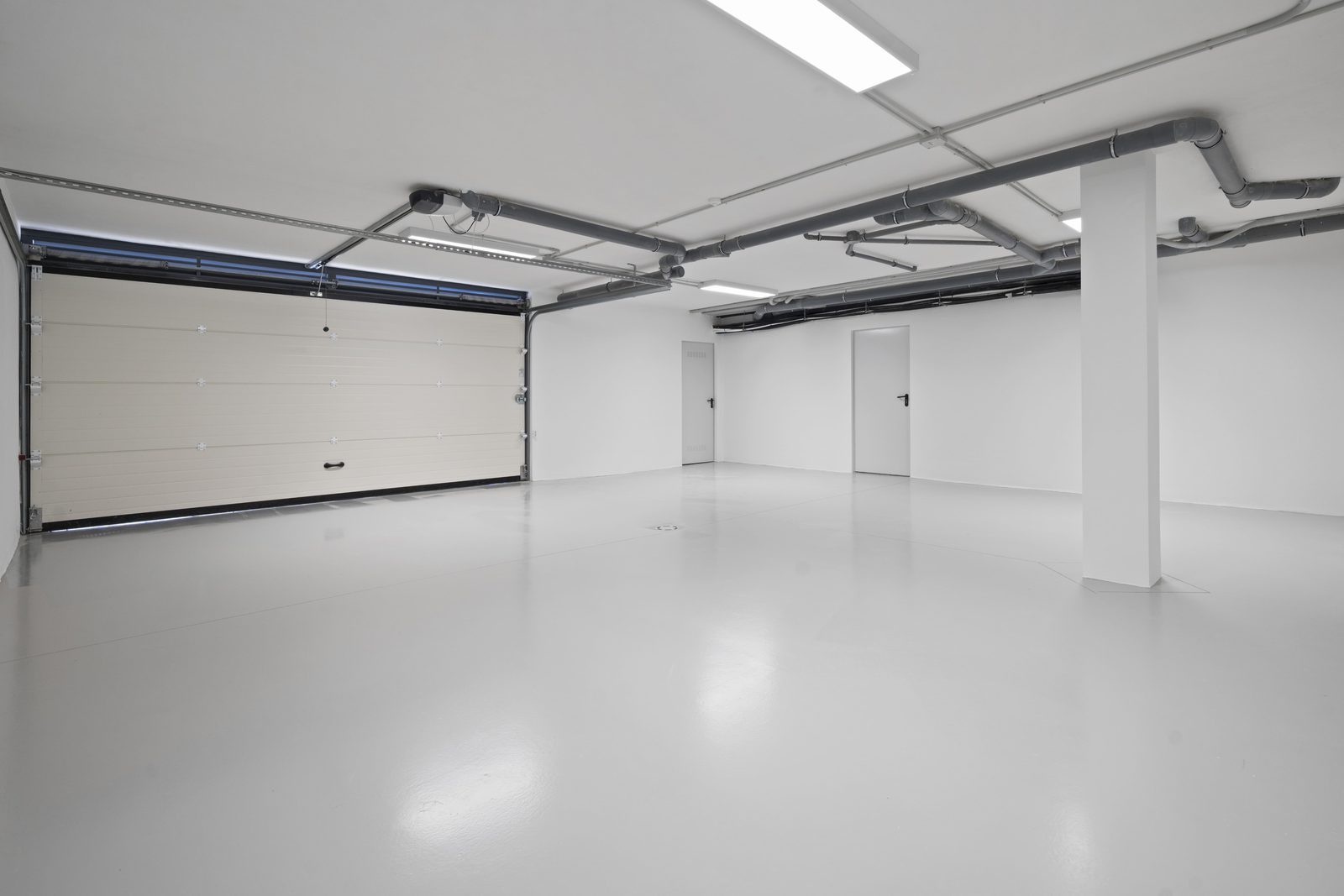 A spacious garage area of a 4-bedroom villa in Benidorm - The Estates