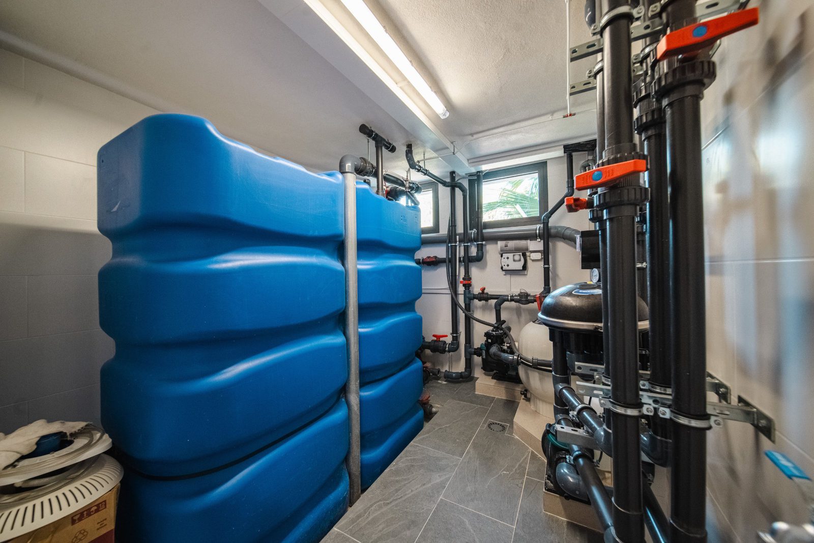 Technical room with water tanks and pipes inside a 5-bedroom villa in Altea - The Estates