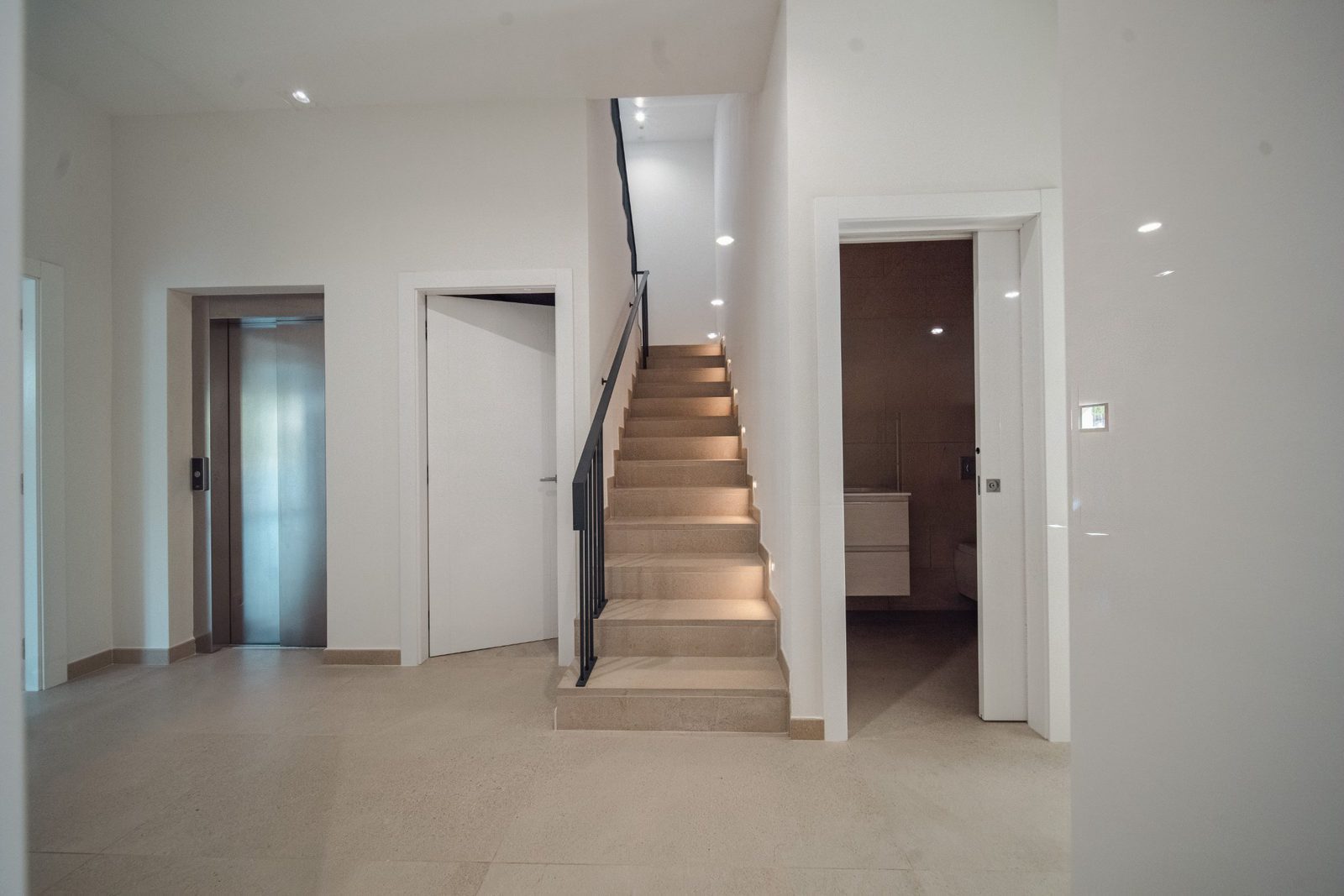 Modern interior hallway with staircase and elevator in a 5-bedroom villa in Altea - The Estates