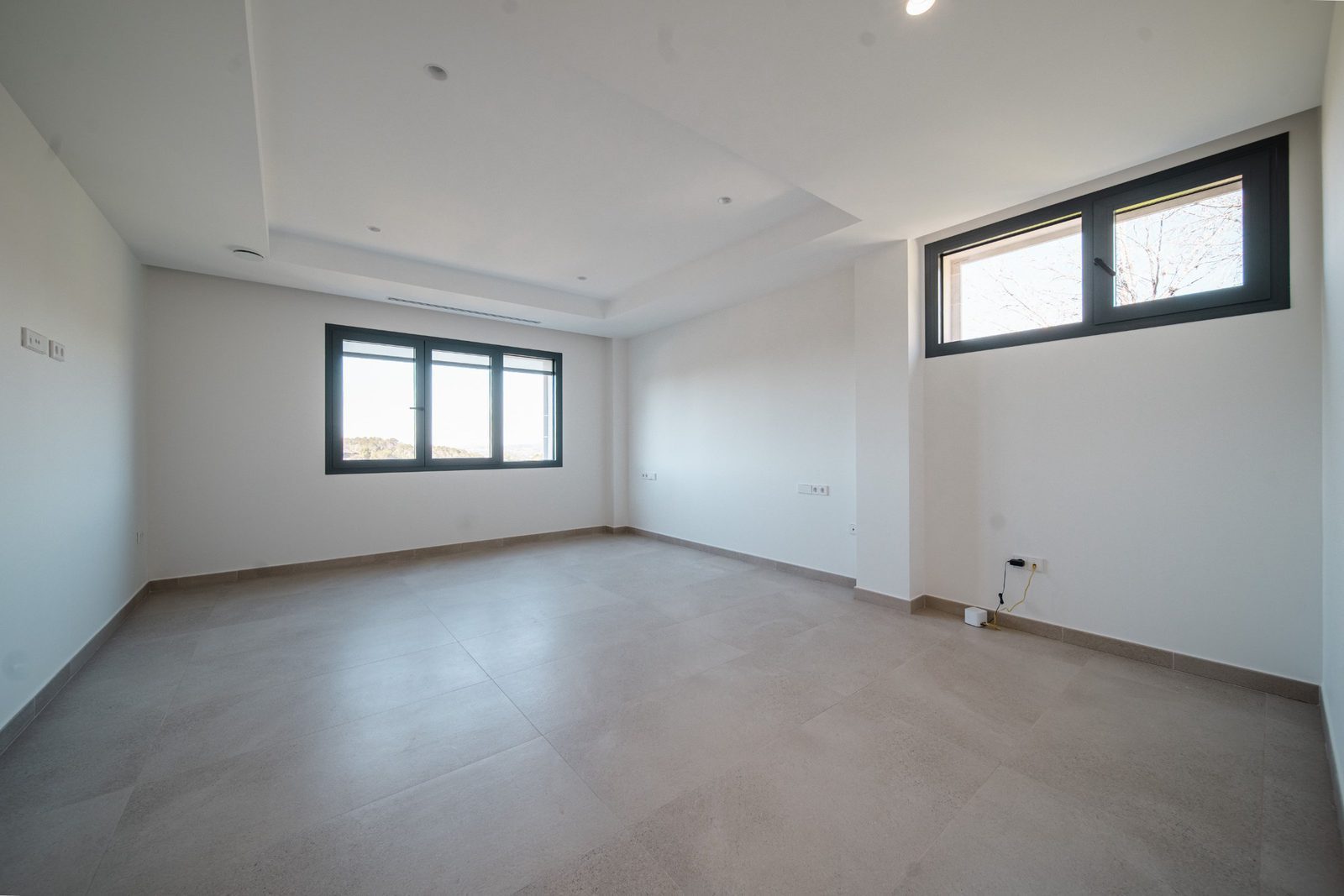 Bright, modern living room with large windows in a 5-bedroom villa in Altea - The Estates