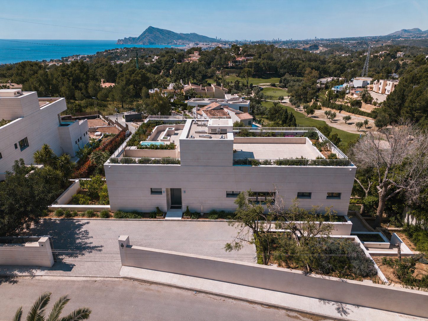 Stunning aerial view of a modern 5-bedroom villa with sea and golf views in Altea - The Estates
