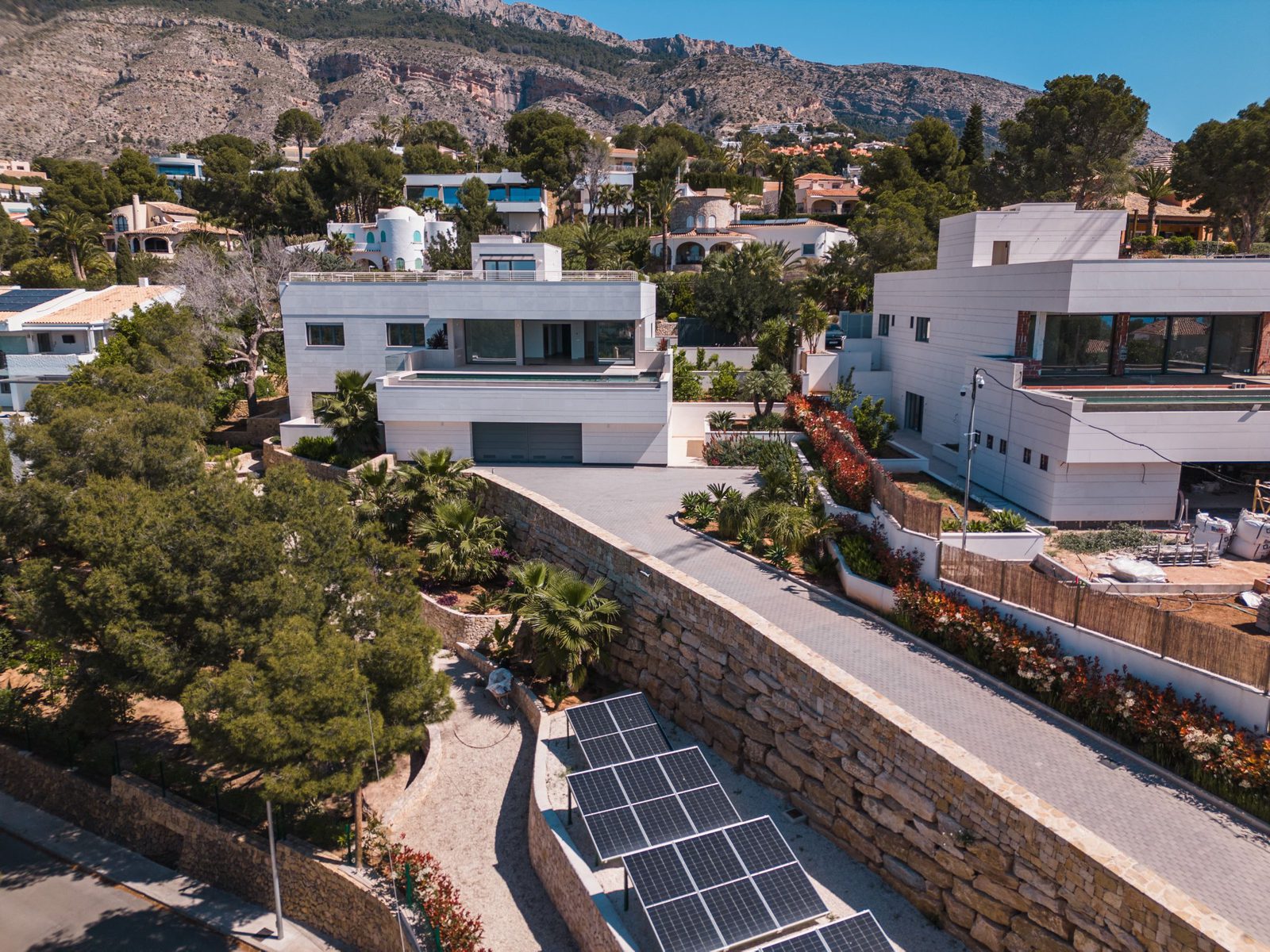 An aerial view of a modern 5-bedroom villa with sea and golf views in Altea - The Estates