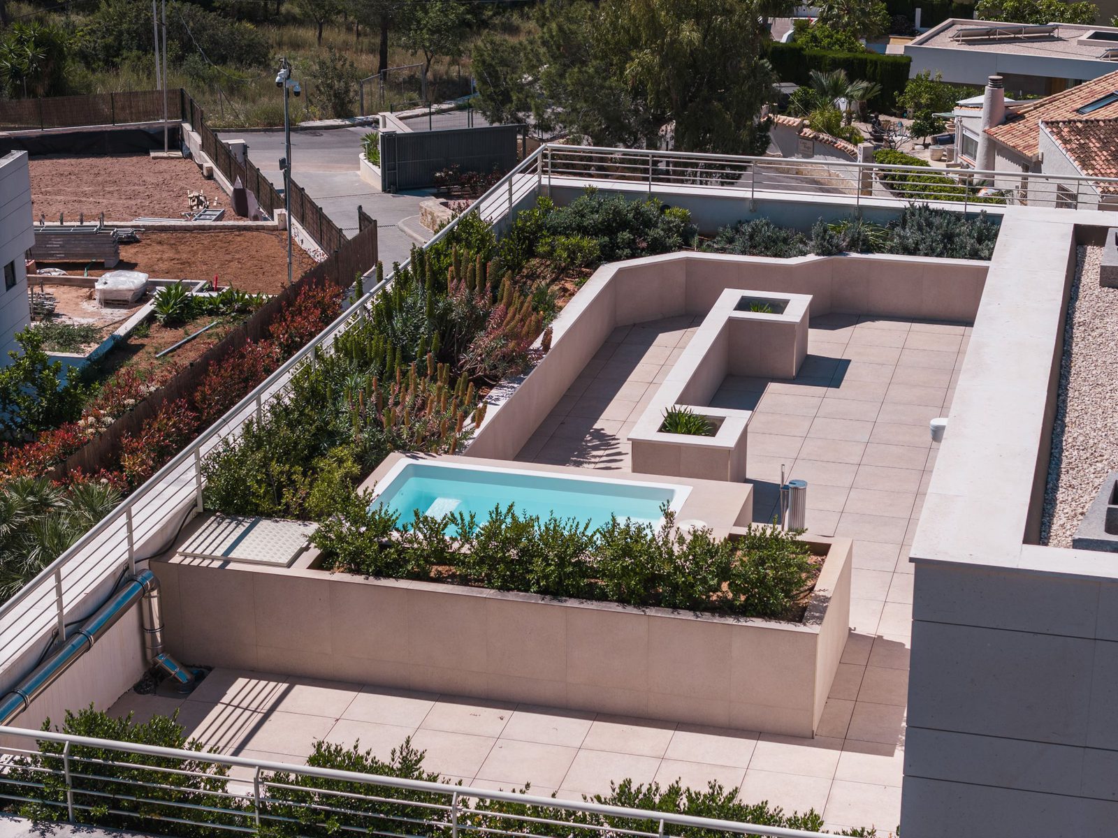 An aerial view of the terrace and pool area of a 5-bedroom villa in Altea - The Estates