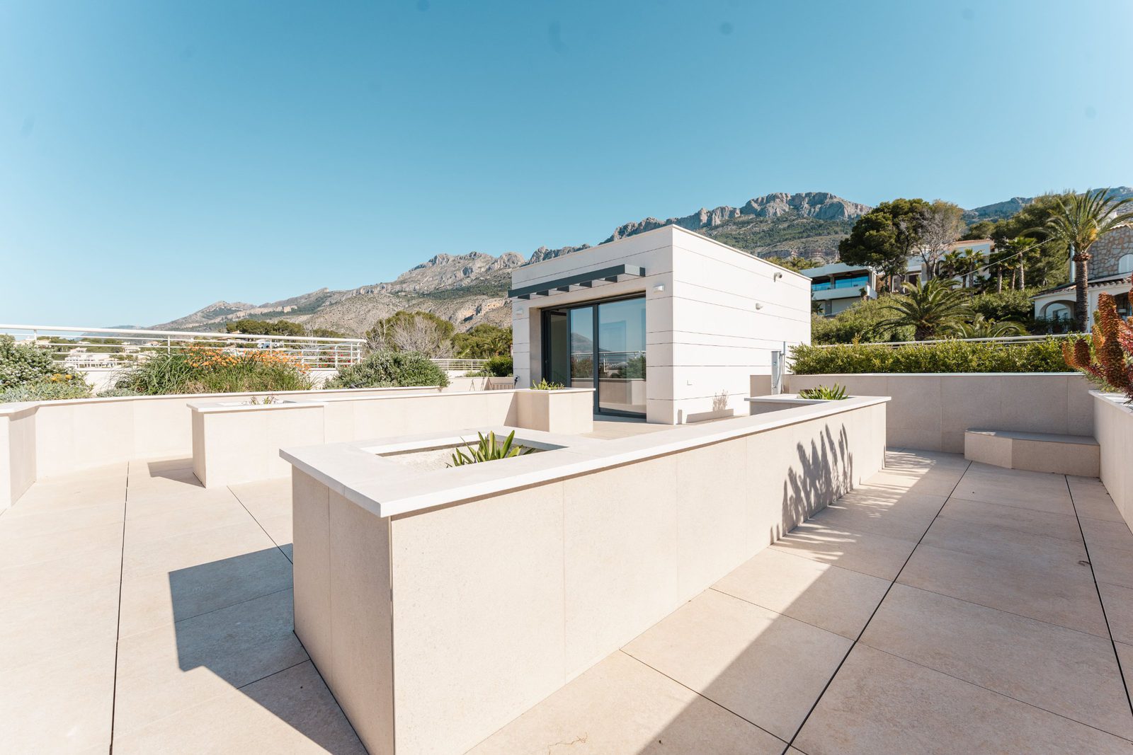 A modern rooftop terrace with mountain and sea views of a 5-bedroom villa in Altea - The Estates
