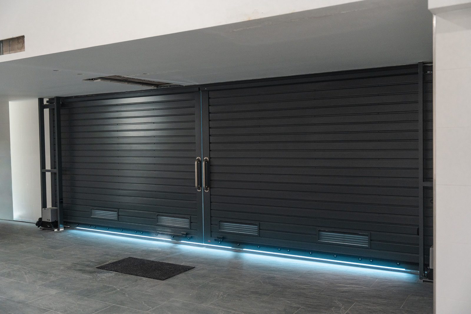 Modern garage doors with blue lighting in a 5-bedroom villa in Altea - The Estates
