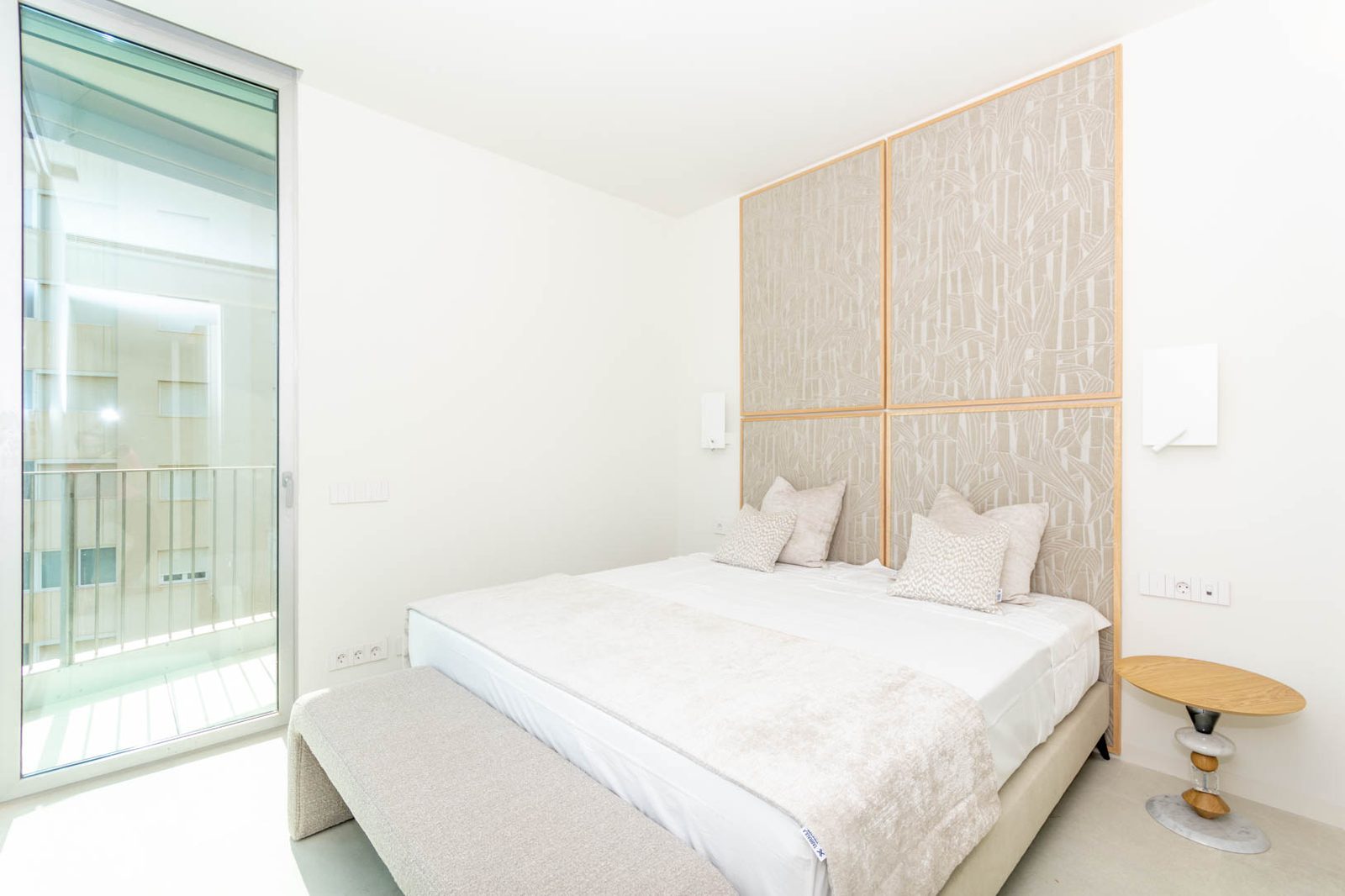 A stylish bedroom with balcony access in a 4-bedroom apartment in Calpe - The Estates