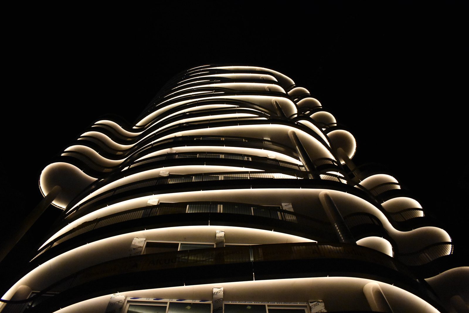 Night view of a modern apartment building in Calpe - The Estates