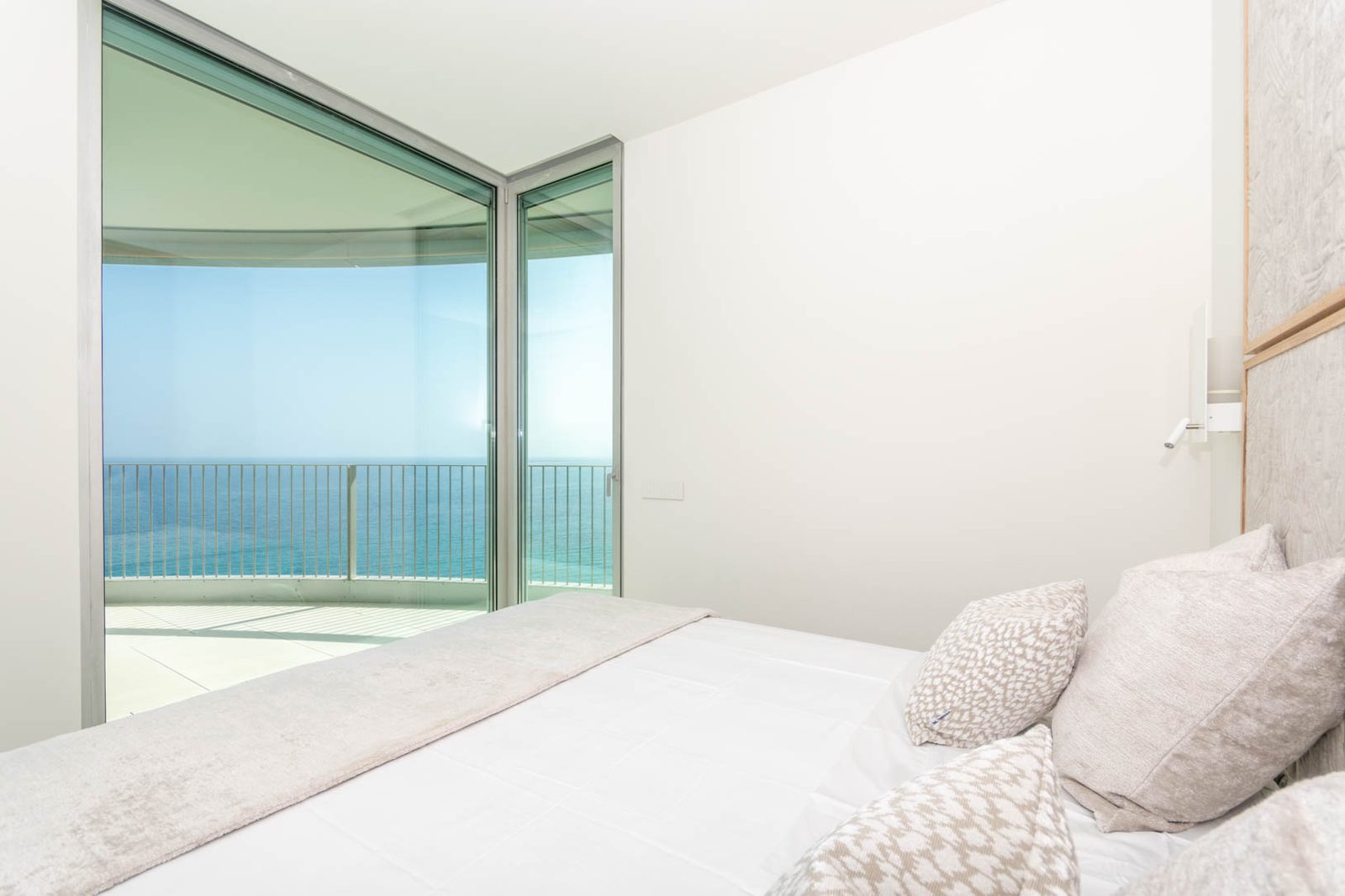 A bright bedroom with stunning sea views from a 4-bedroom apartment in Calpe - The Estates