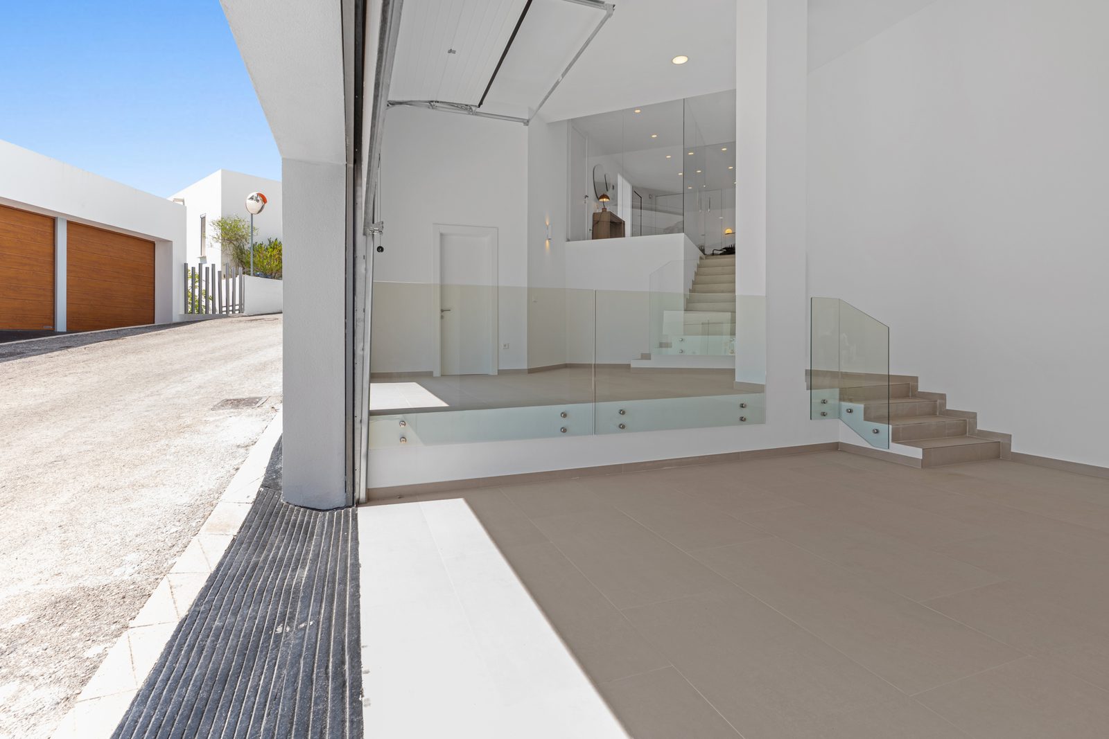 Modern garage and staircase design inside a 4-bedroom villa in Altea - The Estates