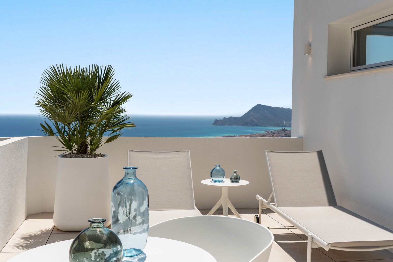 A balcony with sea and mountain views at a 4-bedroom villa in Altea - The Estates