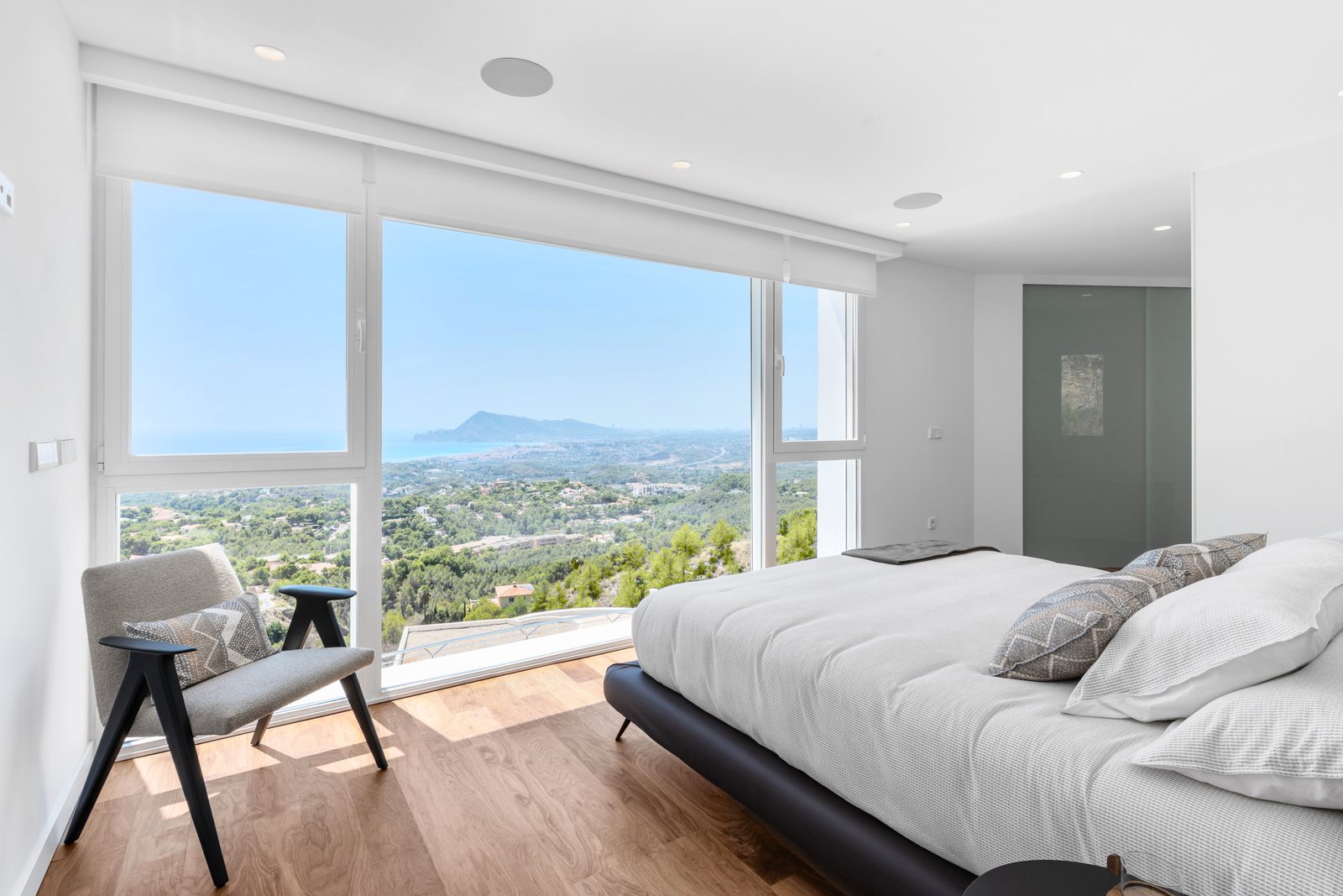 A bright bedroom with panoramic sea and mountain views in a 4-bedroom villa in Altea - The Estates