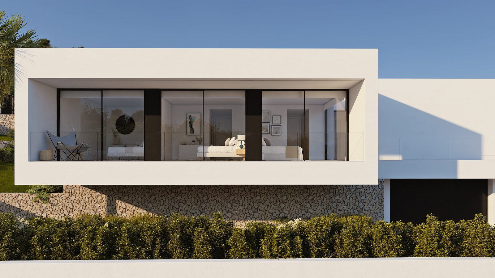 Modern living room with large windows and sea views of a 4-bedroom villa in Benitachell - The Estates