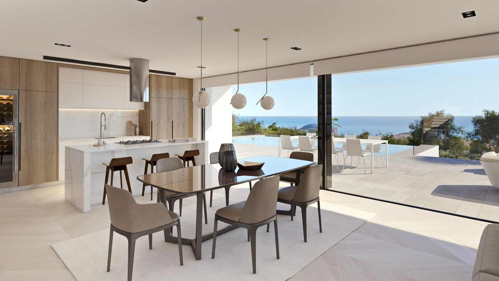 Modern kitchen and dining area with stunning sea views in a 4-bedroom villa in Benitachell - The Estates