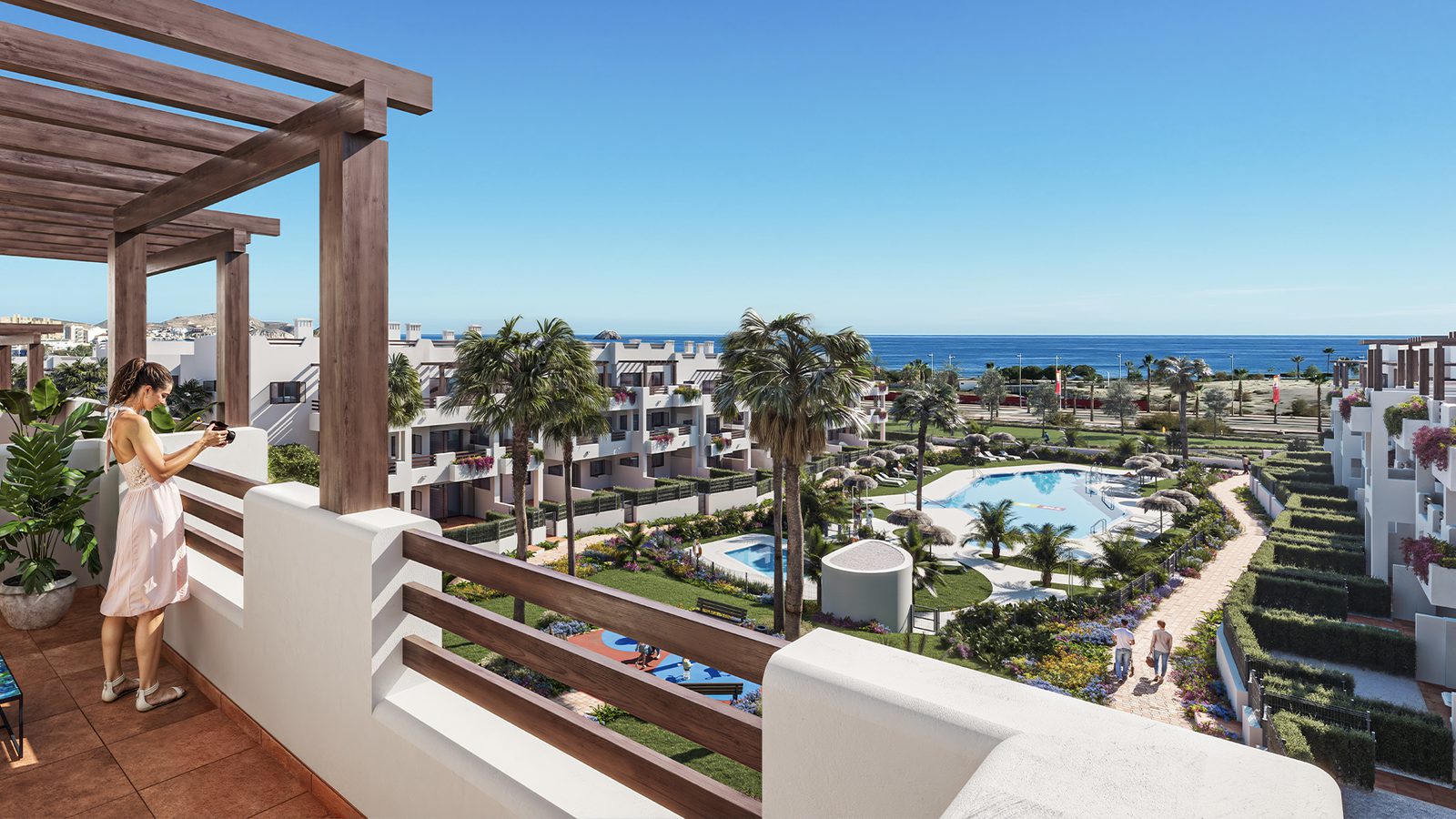A view of a pool and landscaped gardens from a 2-bedroom bungalow in Pulpí - The Estates