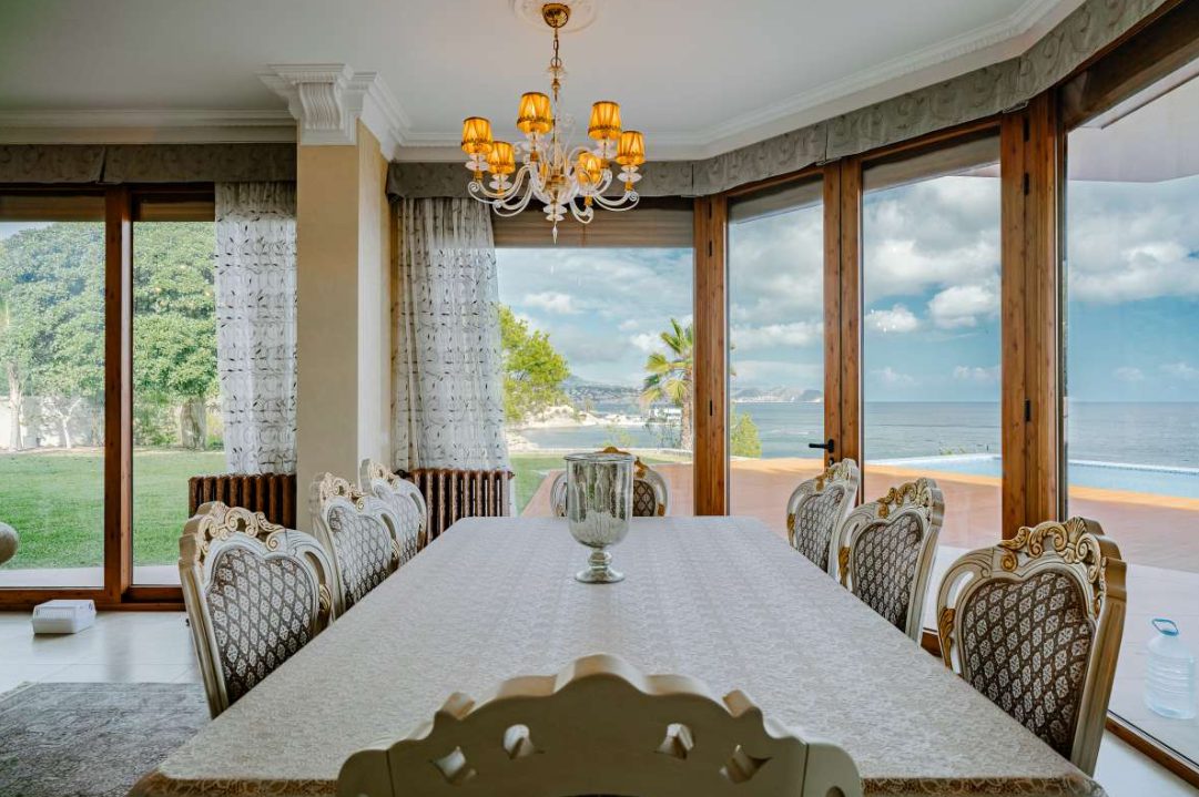 Elegant dining room with panoramic sea views inside a 6-bedroom villa in Calpe - The Estates