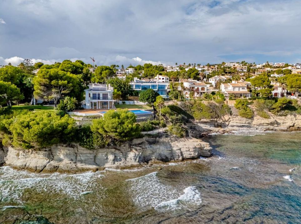 An aerial view of a stunning villa and pool overlooking the sea in Calpe - The Estates