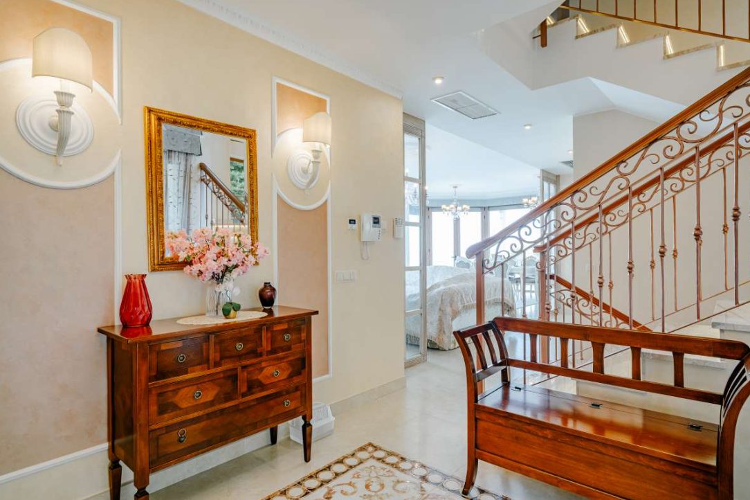 Elegant interior hallway with staircase and decorative details of a 6-bedroom villa in Calpe - The Estates