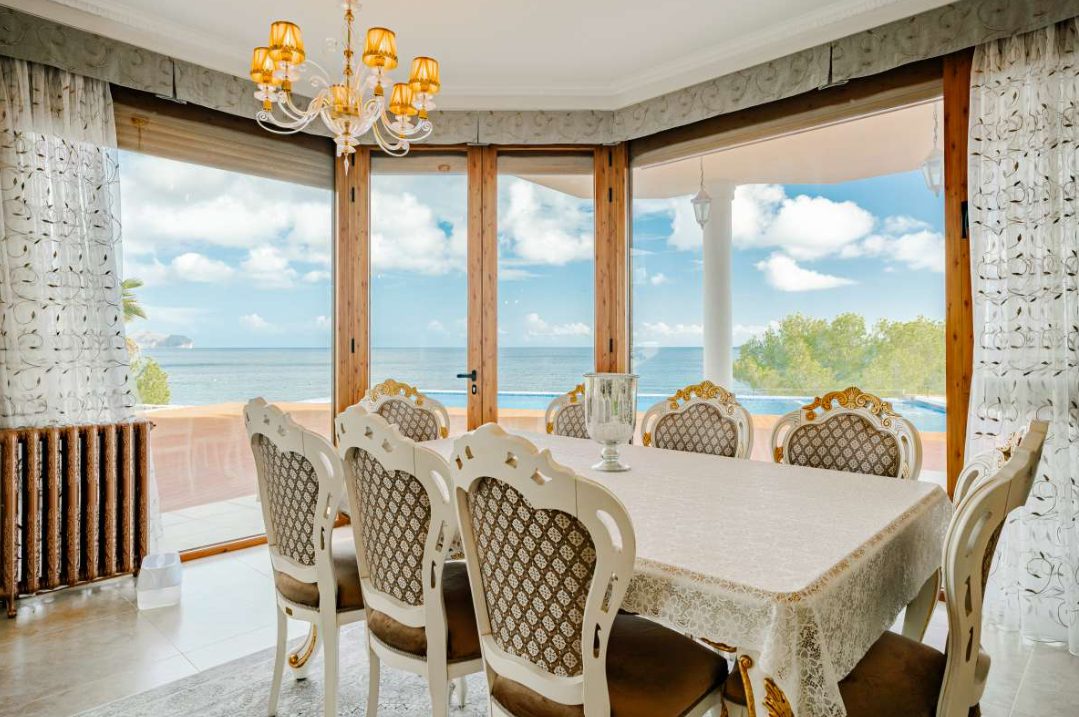 Elegant dining area with sea views inside a 6-bedroom villa in Calpe - The Estates
