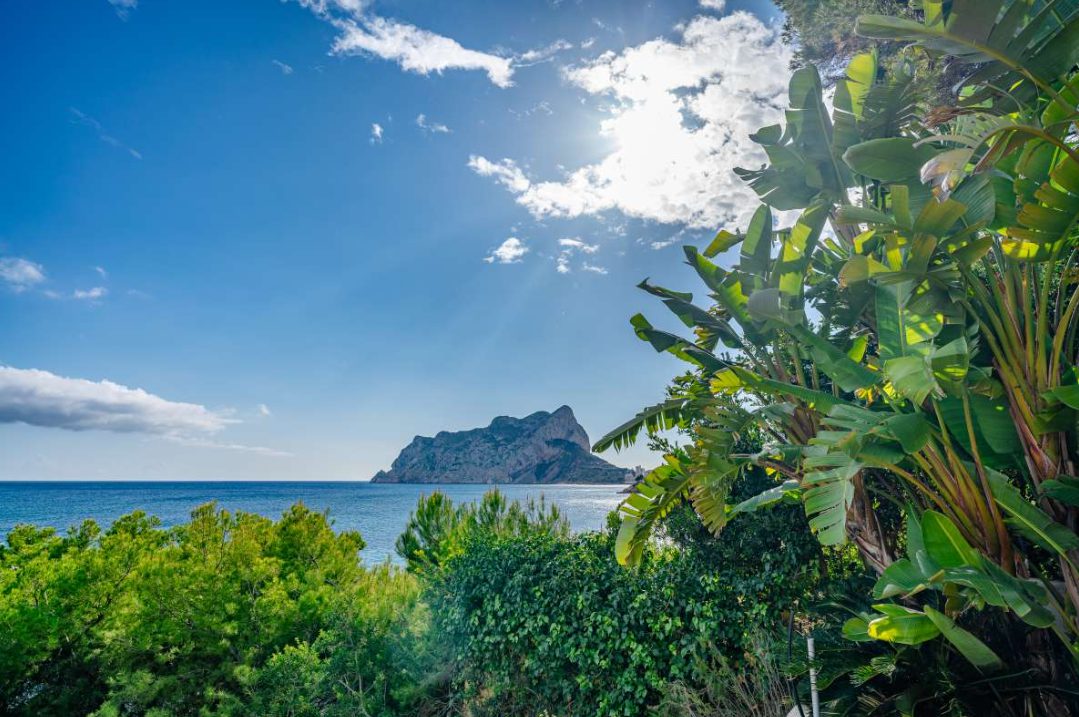 Panoramic sea view with lush greenery and Penon de Ifach from a 6-bedroom villa in Calpe - The Estates