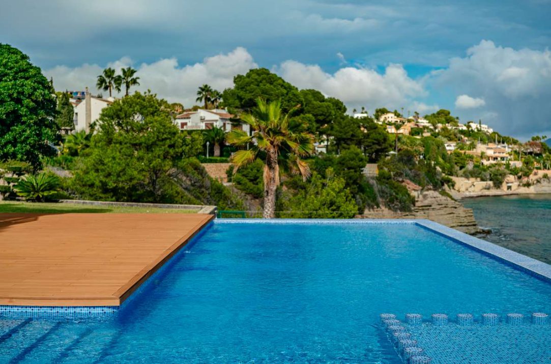 A stunning pool and garden view of a 6-bedroom villa in Calpe - The Estates