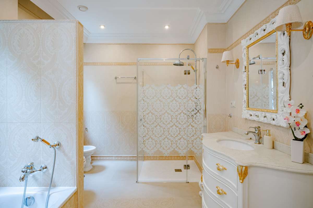 An elegant bathroom with a walk-in shower and double vanity in a 6-bedroom villa in Calpe - The Estates