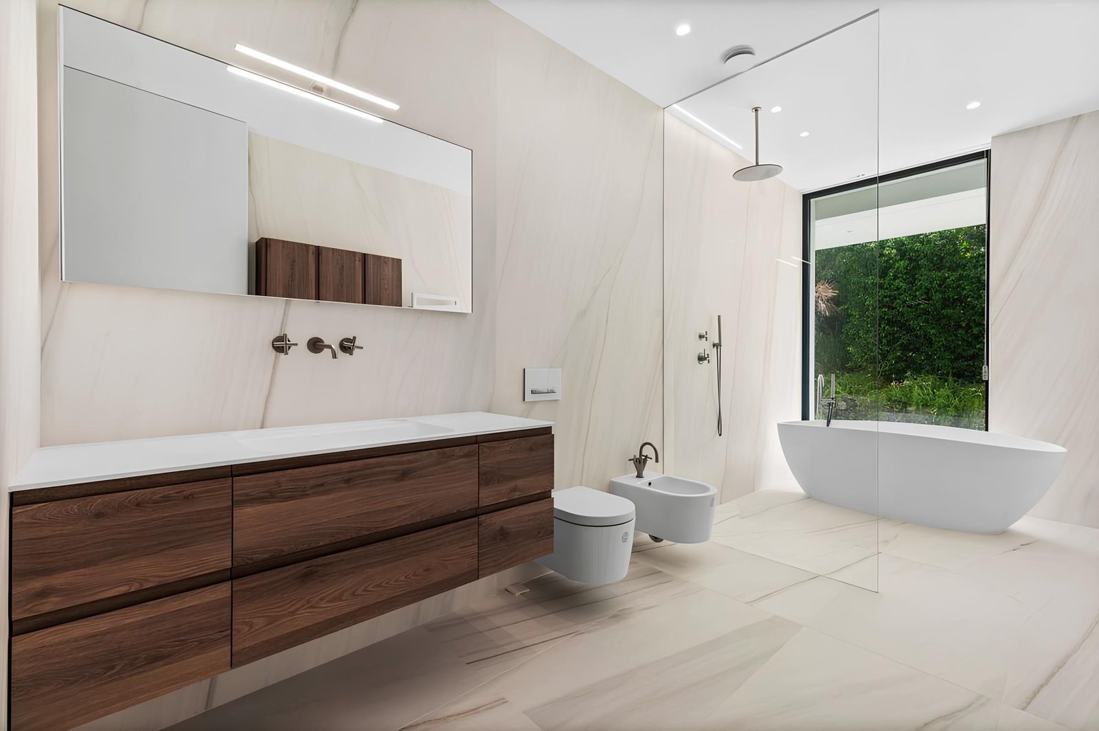 A modern bathroom with a large window overlooking greenery in a 7-bedroom villa in Altea - The Estates