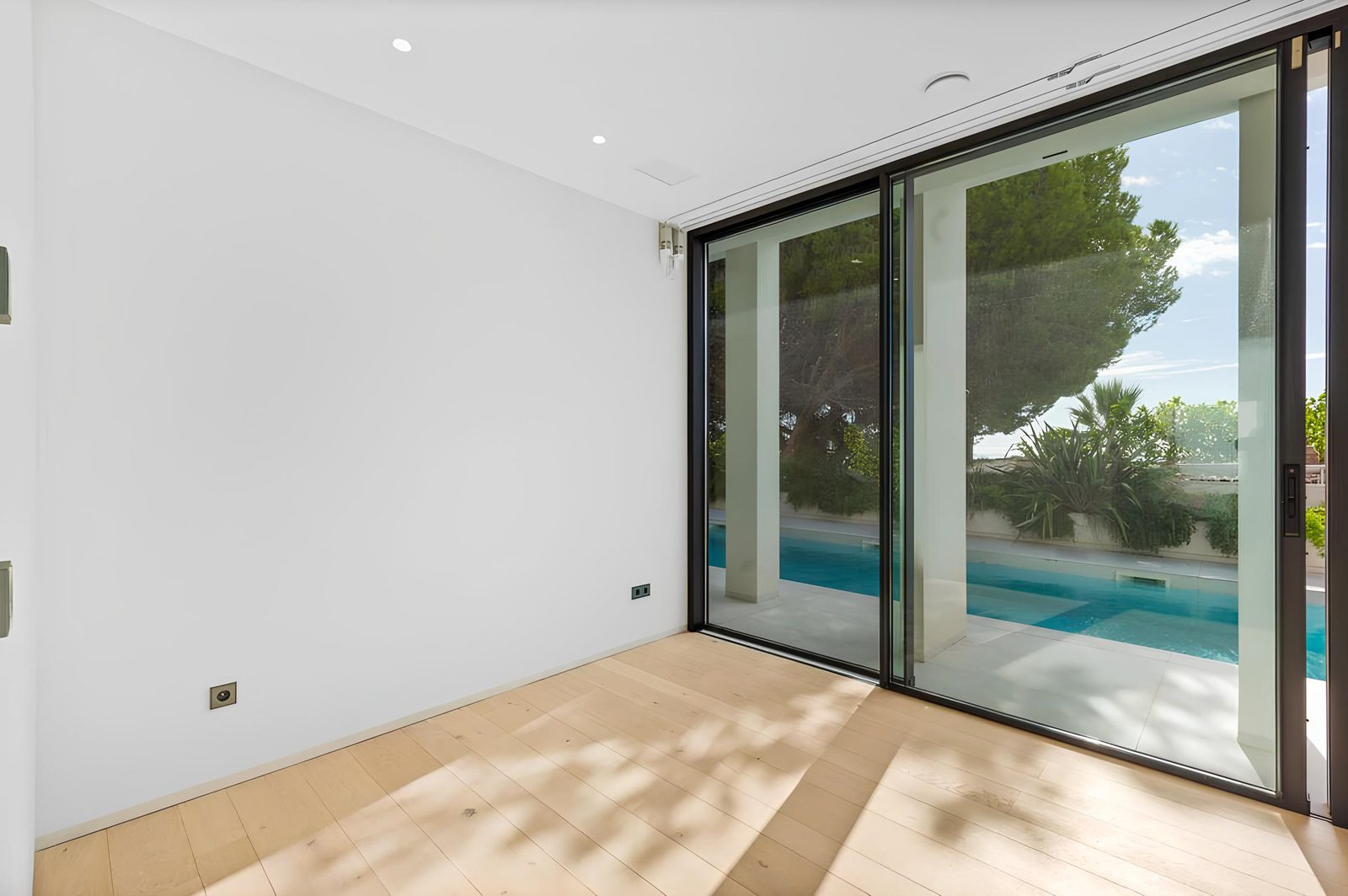 A bright, modern interior with pool views of a 7-bedroom villa in Altea - The Estates