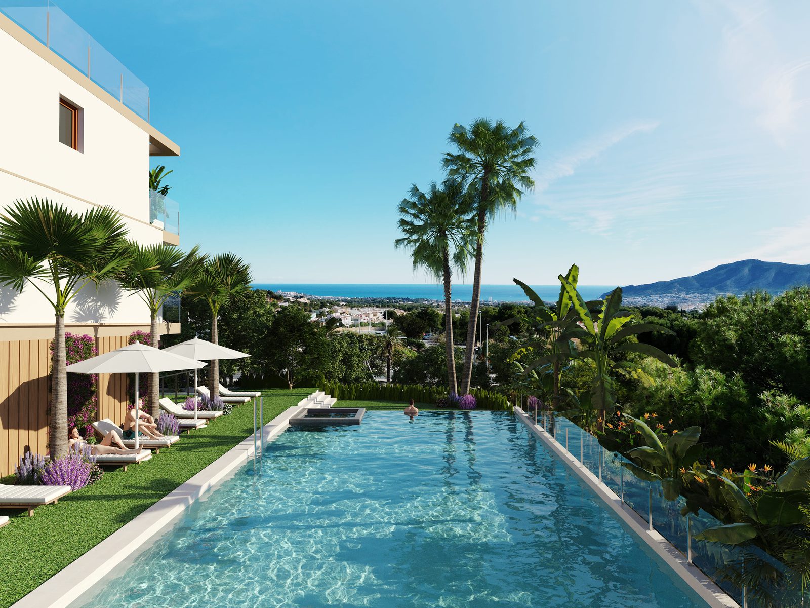 A pool and lounge area with sea and city views of a 4-bedroom townhouse in La Nucía - The Estates