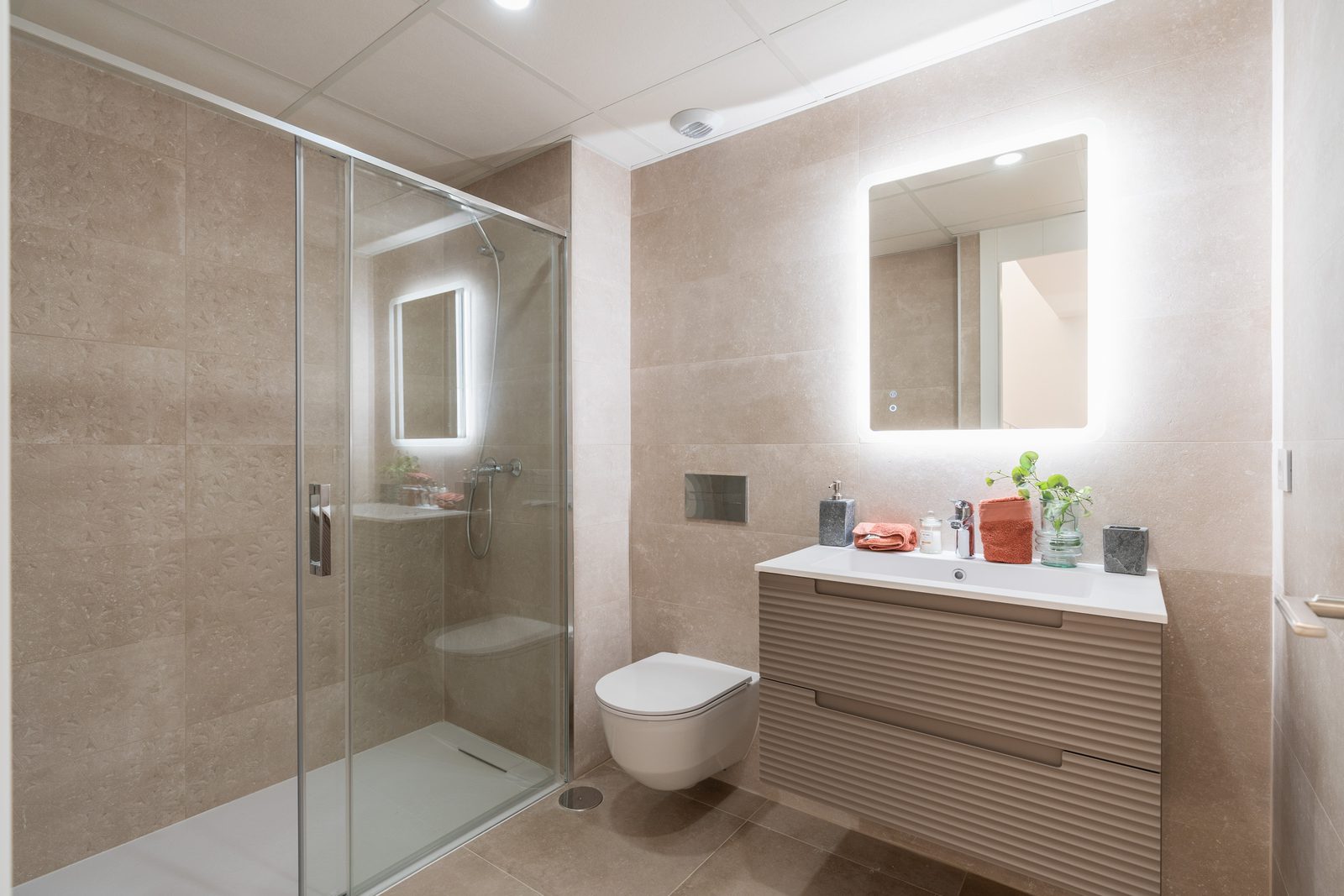 A modern bathroom with a walk-in shower and vanity in a 4-bedroom townhouse in La Nucía - The Estates