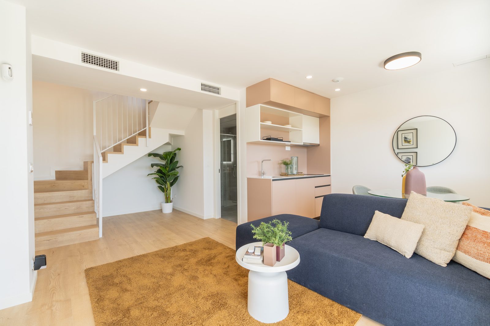 Stylish interior with a modern living area and staircase in a 4-bedroom townhouse in La Nucía - The Estates