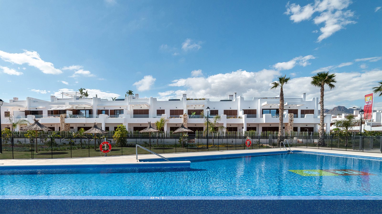 A view of a 2-bedroom bungalow with a pool and sea views in Pulpí - The Estates