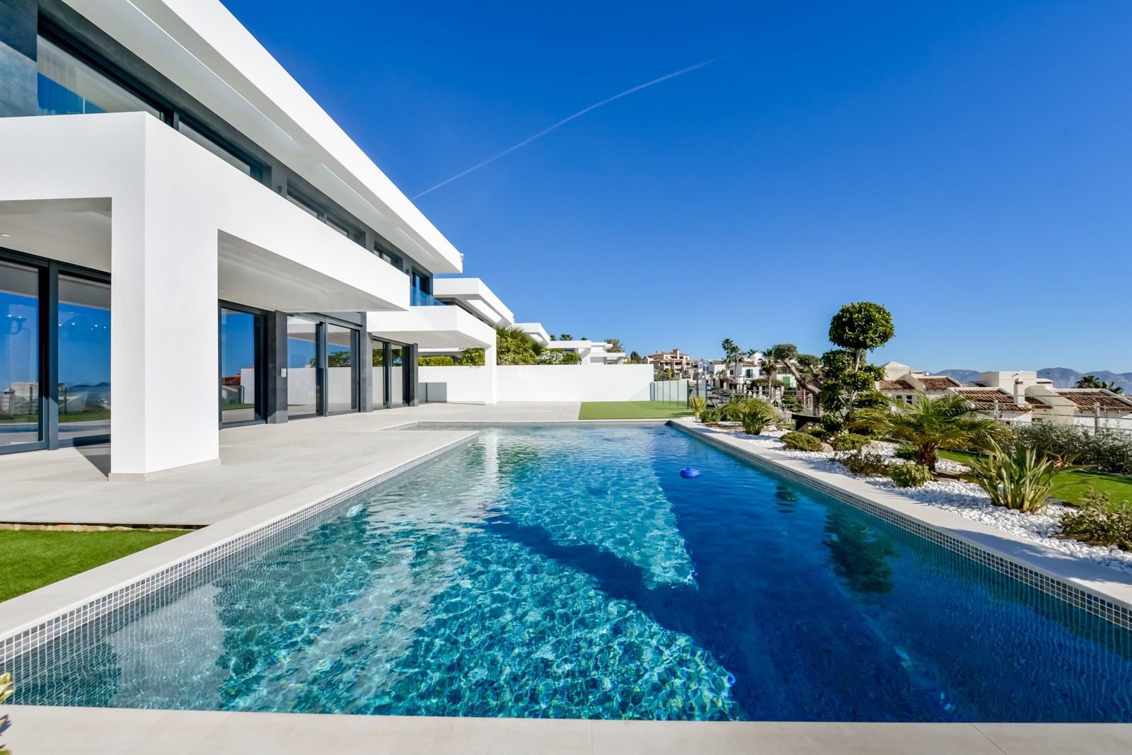 A luxurious pool and modern architecture of a 7-bedroom villa in Finestrat - The Estates