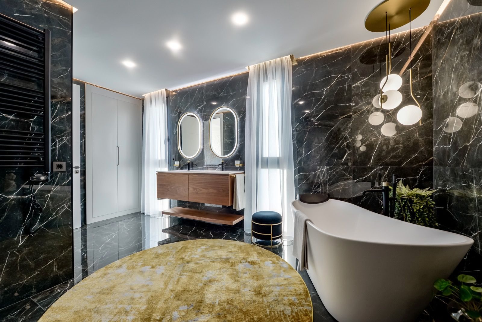 Luxurious bathroom design with marble, modern fixtures, and a freestanding tub in a 7-bedroom villa in Finestrat - The Estates