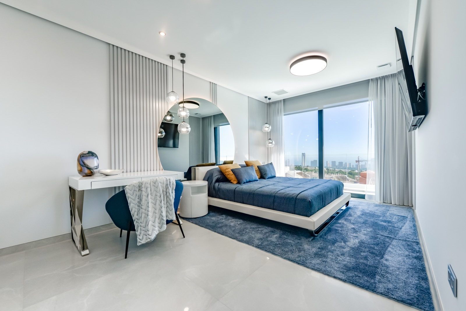 A modern bedroom with city and sea views in a 7-bedroom villa in Finestrat - The Estates