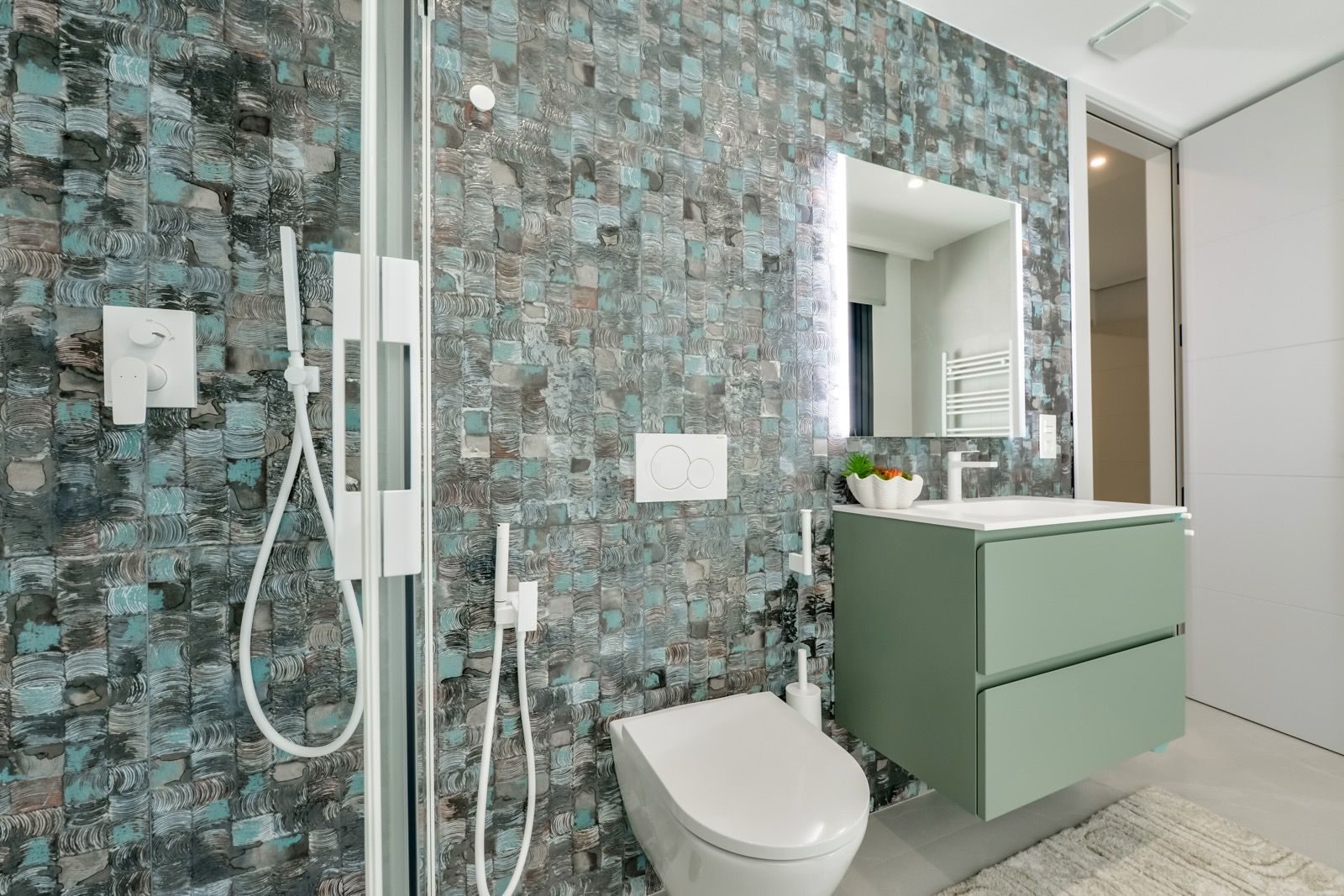 Stylish bathroom with mosaic tile and modern fixtures in a 7-bedroom villa in Finestrat - The Estates