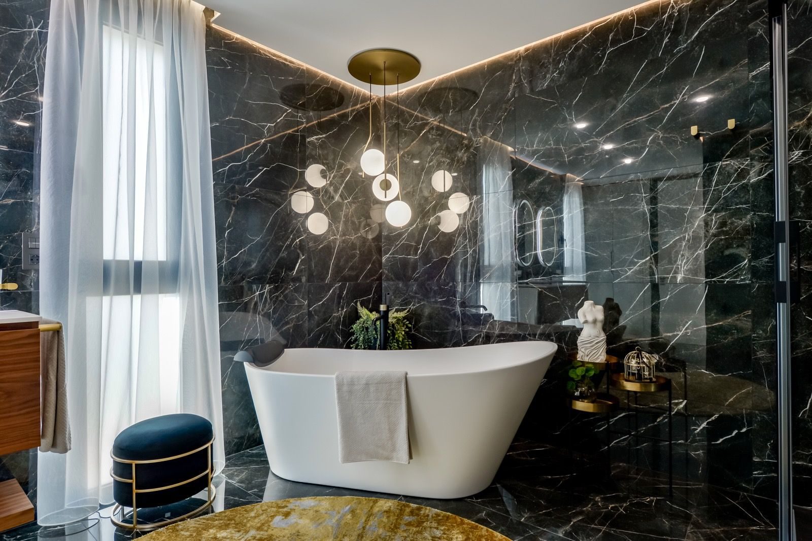 Luxurious marble bathroom with a freestanding tub in a 7-bedroom villa in Finestrat - The Estates