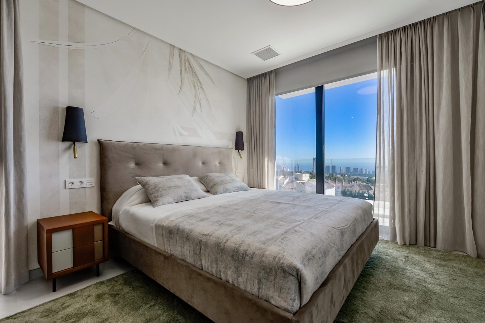 Stylish bedroom with stunning sea and city views inside a 7-bedroom villa in Finestrat - The Estates
