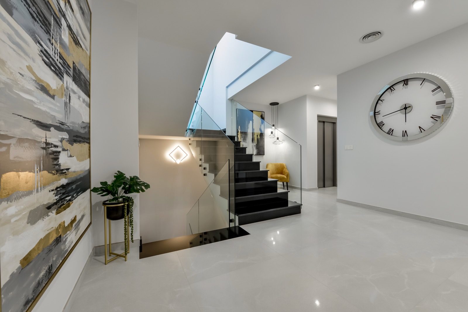 Stylish interior hallway with staircase and modern decor in a 7-bedroom villa in Finestrat - The Estates