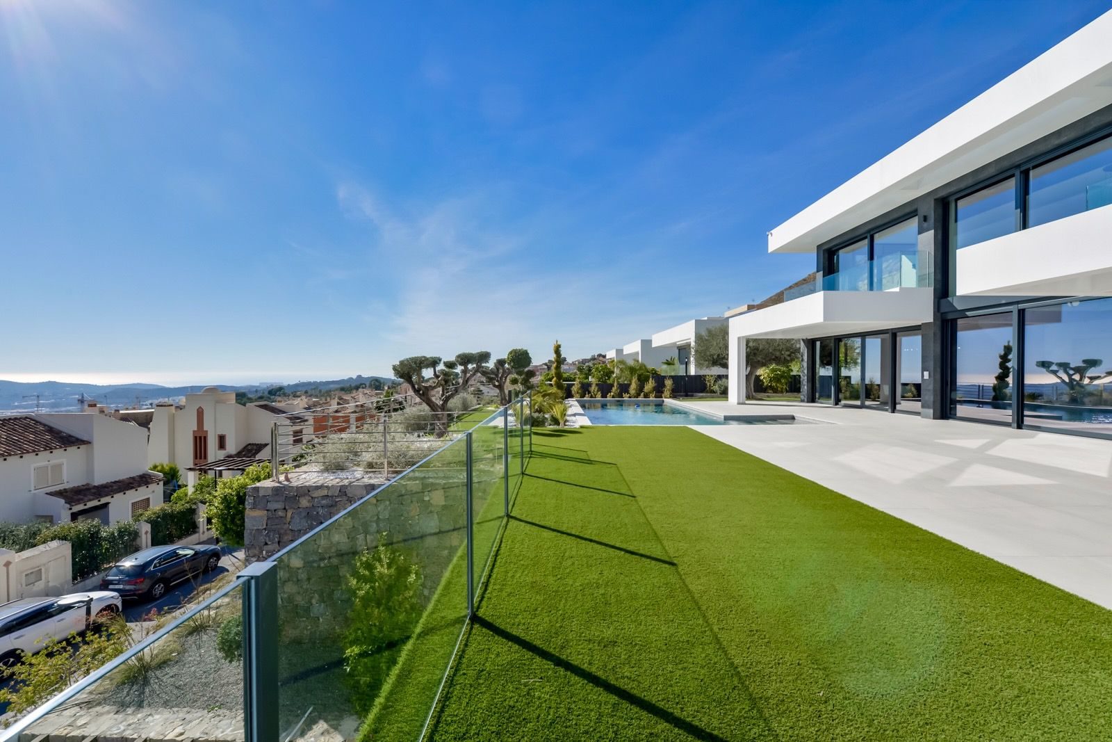 A stunning view of the pool and terrace of a 7-bedroom villa in Finestrat - The Estates