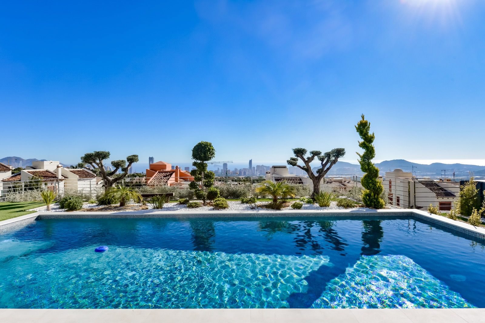 A swimming pool and stunning sea and city views of a 7-bedroom villa in Finestrat - The Estates