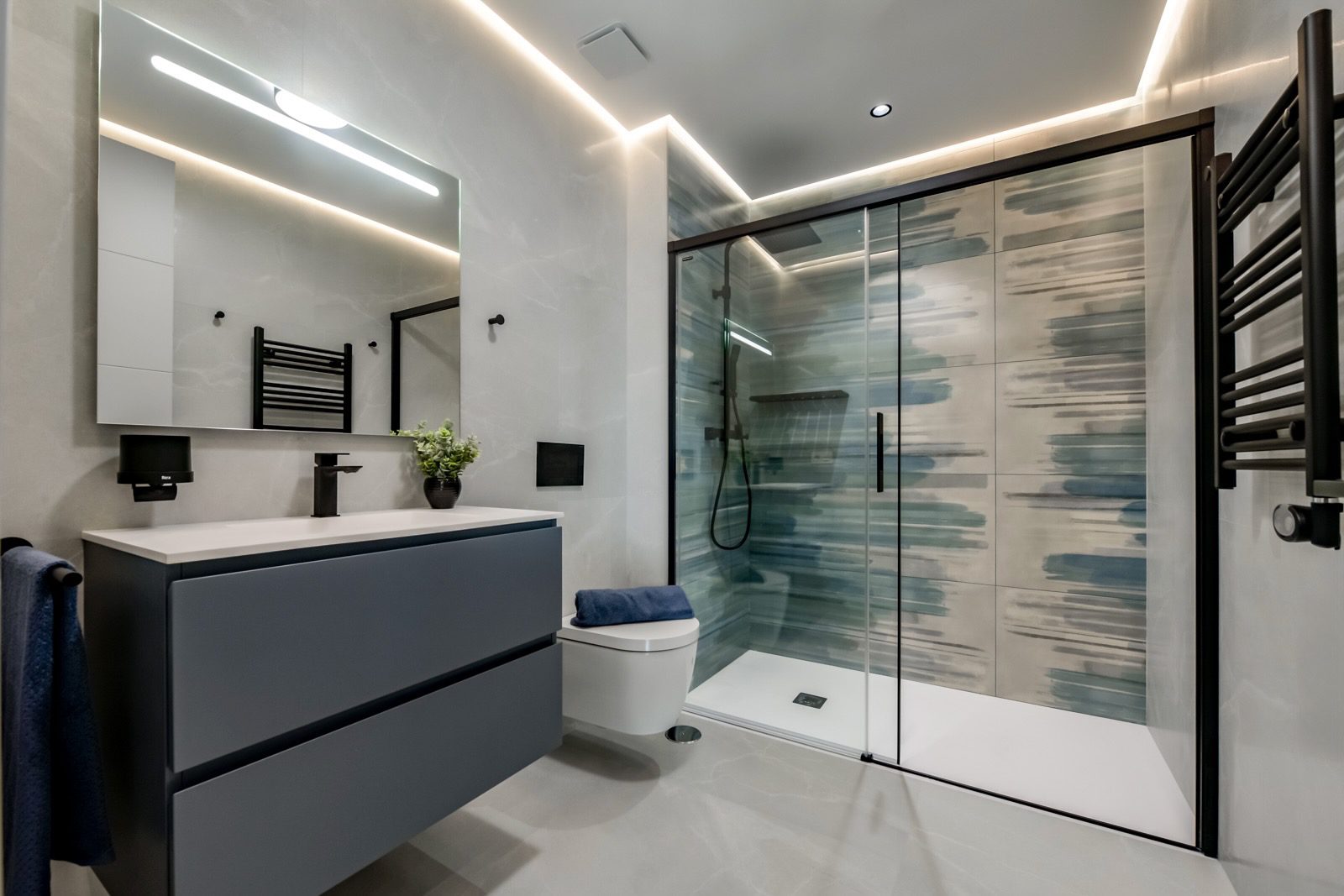 A modern bathroom with a walk-in shower and stylish fixtures in a 7-bedroom villa in Finestrat - The Estates