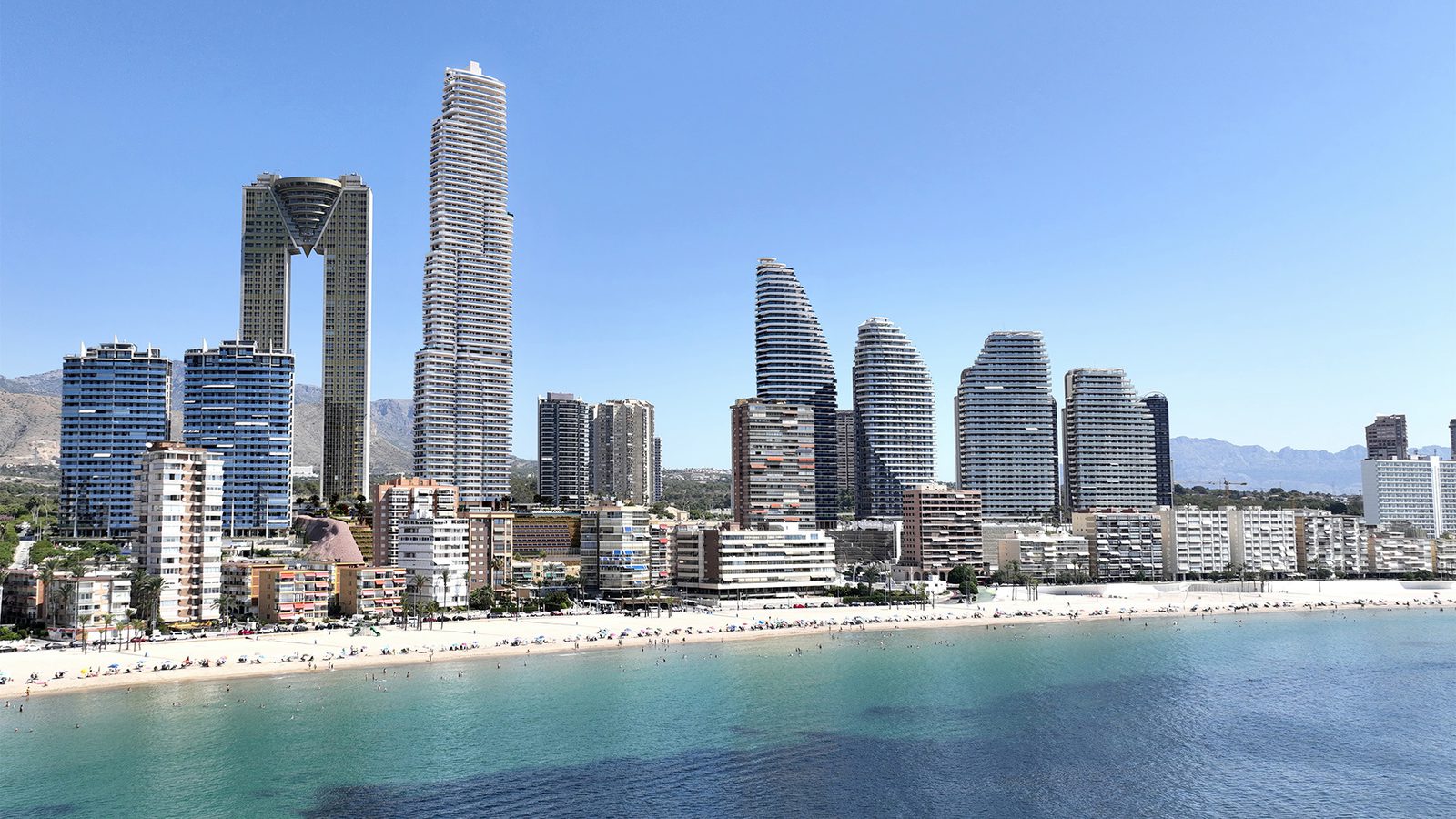 A coastal view of a 2-bedroom apartment in Benidorm with high-rise buildings and a sandy beach - The Estates