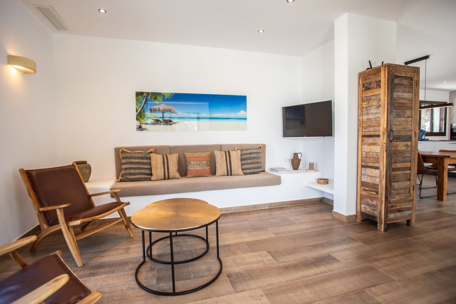 Stylish living room with a large TV and comfortable seating in a 3-bedroom villa in Javea - The Estates