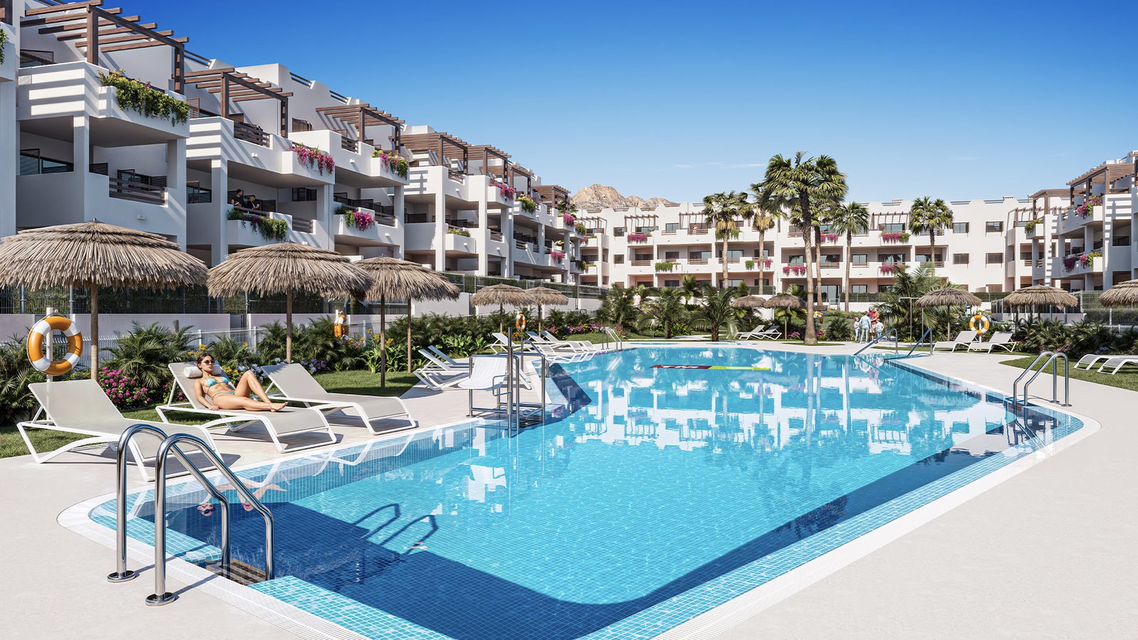 A swimming pool and lounge area next to a 1-bedroom bungalow in Pulpí - The Estates