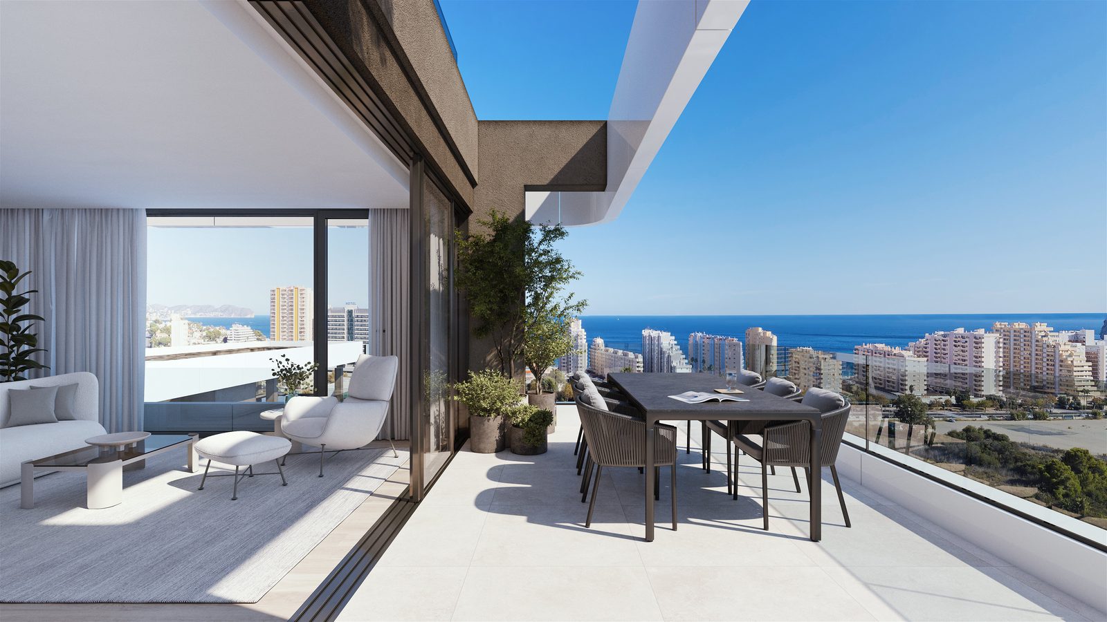 A bright living and dining area with a terrace and stunning sea views of a 3-bedroom apartment in Calpe - The Estates